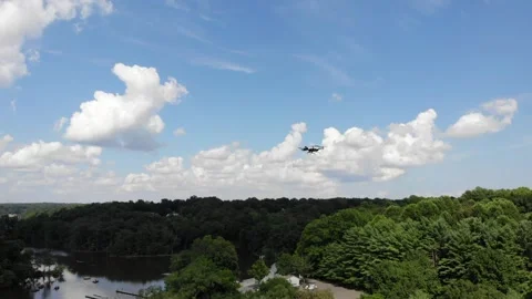 Aerial Orbiting shot of a drone in flight Stock Footage 246451474