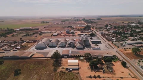 Aerial orbiting shot of a grain storage industrial complex Stock Footage 341029223