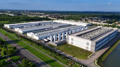 Aerial orbiting shot of a large data center facility and server farm in Ohio Stock Footage 346147509