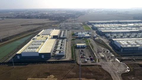 Aerial orbiting shot of large modern technology data center under construct.. Stock Footage 339231342