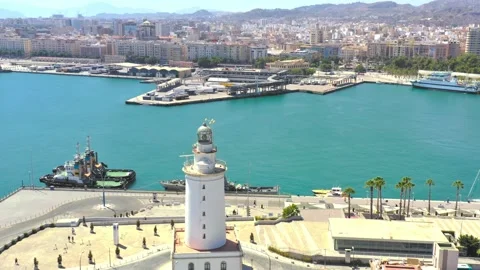 Aerial orbiting shot of lighthouse in Malaga, Spain Stock Footage 229016871