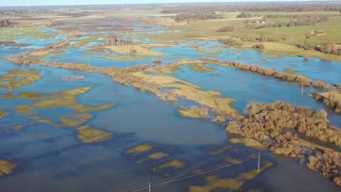 Aerial orbiting shot over flooded fields and meadows Stock Footage 171216962
