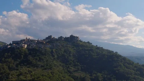 Aerial orbiting view of the hilltop town of Castiglione in Sicily Stock Footage 112006113
