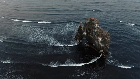 Aerial orbiting view of the stone on the sea in Hvitserkur, North Iceland Stock Footage 117349851