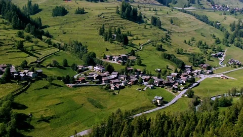 Aerial orbiting view of a typical village of  Aosta valley in the Italian Alps Stock Footage 112007687