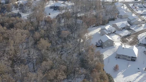Aerial of the outskirts of a residential area covered in snow 스톡 동영상 111663306