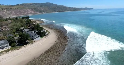 Aerial over beach at Rincon Point, California Stock Footage 73020013