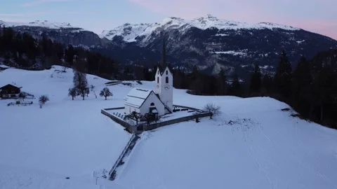 Aerial over beautiful church in Swiss Alps Stock Footage