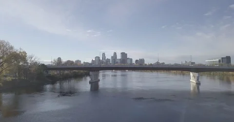 Aerial over bridge to reveal downtown Minneapolis Stock Footage
