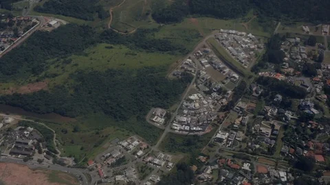 Aerial over changing types of residential dwellings contrasting in toplogy and 스톡 동영상 101302260