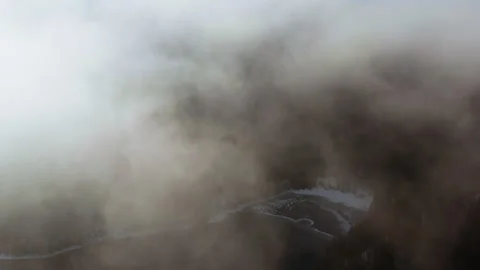 Aerial over clouds with forest underneath Stock-Footage 146770079