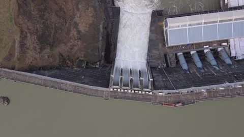 Aerial Over Clyde Dam Spill Gates Releasing Water on Clutha River, New Zealand Stock Footage 346453402