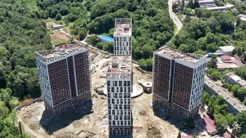 Aerial over the construction site. work as construction, builders work 動画素材 155042408