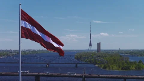 Aerial over Daugava River, Riga, with Latvian flag and TV Tower Stock Footage 338036218
