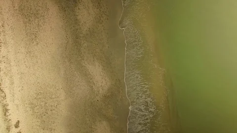 Aerial Over Empty Green-Water Beach, 4K Stock Footage 72883192