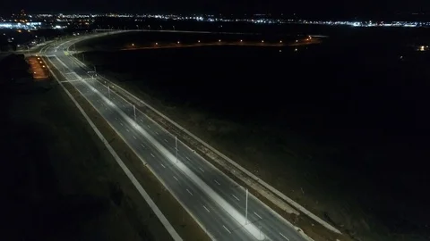Aerial Over Empty Highway Through Town At Night Stock-Footage 107752100