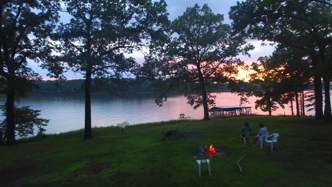 Aerial over a fire sunset Stock Footage 77697608