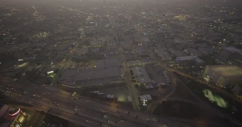 Aerial over freeway moving toward Los Angeles Staples Center, evening Video stock 103421193