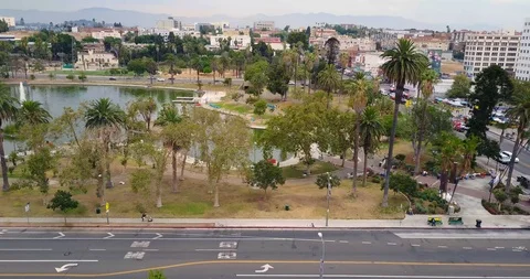 Aerial over intersection to pond park Stock Footage 114031940