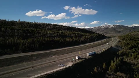 Aerial over interstate 70 in Silverthorne Colorado in springtime Stock Footage 274078868