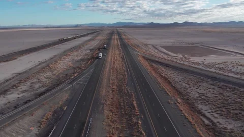 Aerial over an interstate highway with an approaching train Stock Footage 256712568