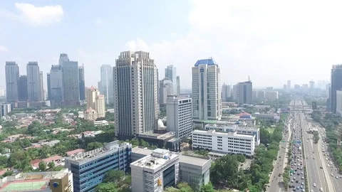Aerial over Jakarta Building skycraper fly forwar zoom in Stock Footage
