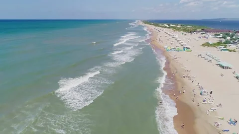 Aerial over the long sandy spit with a beach and azure water on a sunny summer Video stock 219772460