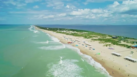 Aerial over the long sandy spit with a beach and azure water on a sunny summer Stock Footage 219773219