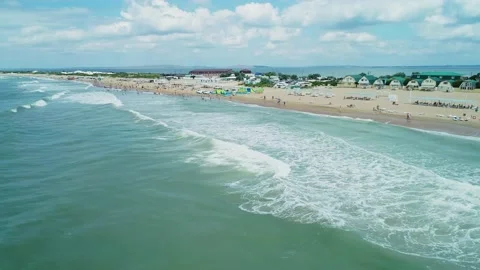 Aerial over the long sandy spit with a beach and azure water on a sunny day Stock Footage 219773313