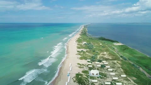 Aerial over the long sandy spit with a beach and azure water on a summer day Stock-Footage 219773447