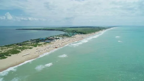 Aerial over the long sandy spit with a beach and azure water on a sunny summer Stock Footage 219773855