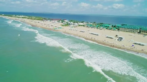 Aerial over the long sandy spit with a beach and azure water on a sunny summer Stock Footage 219774587