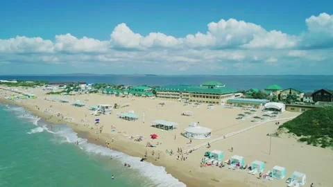 Aerial over the long sandy spit with a beach and azure water on a sunny summer Stock Footage 219774832