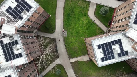 Aerial over man walking through housing project Queensbridge Astoria Queens NYC 스톡 동영상 188019514
