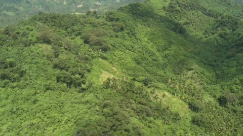 Aerial over a Mountain Range covered in Rain Forest Stock Footage 549842