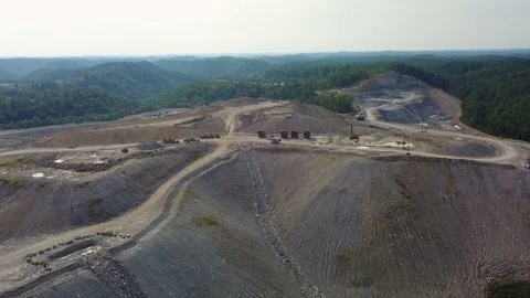 An aerial over a mountaintop removal coal strip mine in West Virginia. Stock Footage