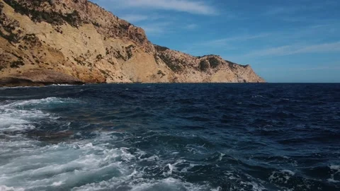 Aerial over natural infinity pool over ocean at Sa Pedrera de Cala d'Hort, Stock Footage 220825568