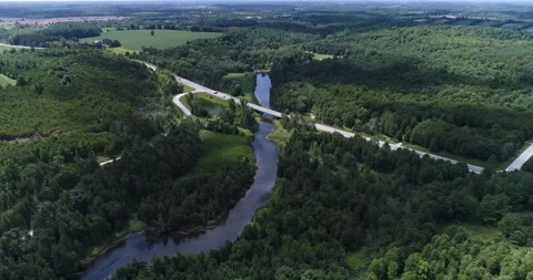 Aerial Over Nice Rural River And View Of Highway Bridge In The Forest Landscape Stock Footage 200038394