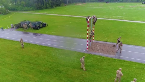 An aerial over an obstacle course during army basic training. Stock Footage 79418080