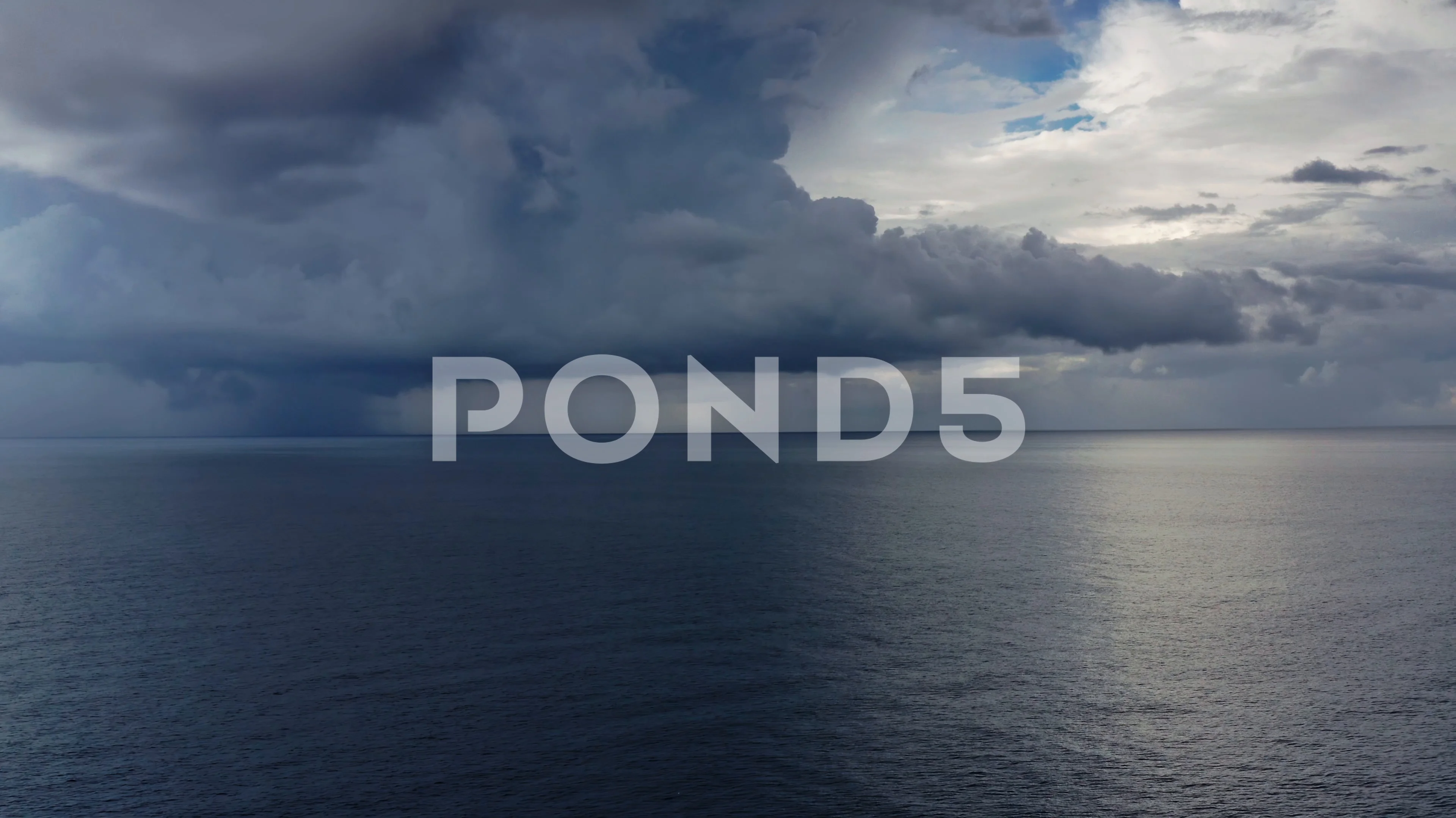 Aerial over ocean, deep storm clouds and, Stock Video