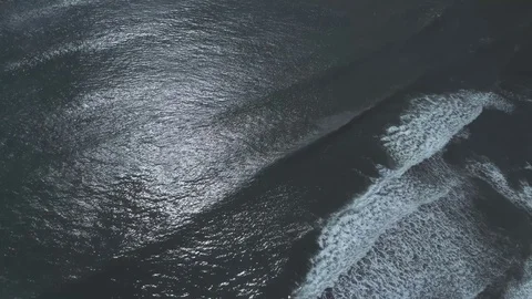 Aerial over ocean waves breaking Stock Footage 79515115