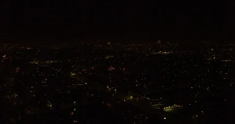 Aerial over residences, fireworks exploding above, night Stock-Footage 102065375