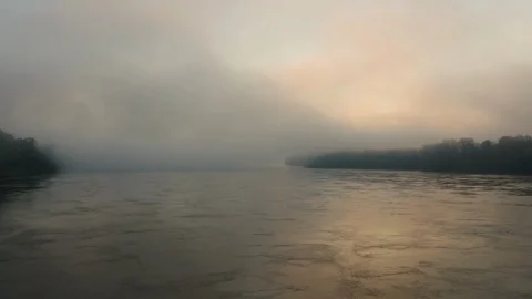 Aerial over a river that is covered in a light fog Stock Footage 108779822