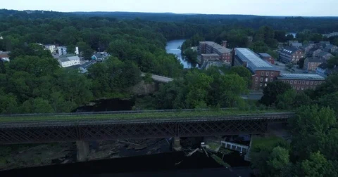 Aerial Over River in Small New England Town Stock Footage 78174419