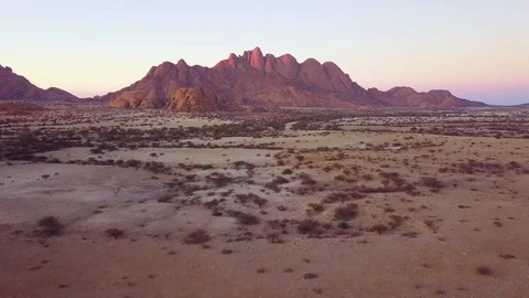 Aerial over rugged desert landscape of Spitzkoppe, Namibia, Africa. Stock Footage