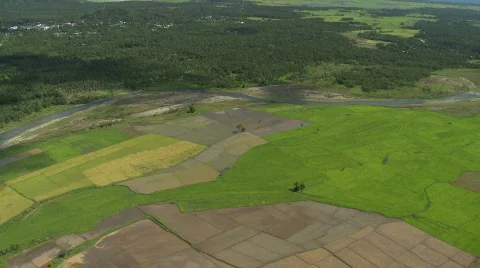 Aerial over rural fields with a river going right through Video stock 640413