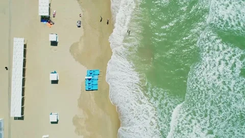 Aerial over the sandy beach with many people and azure water on a sunny summer Stock-Footage 219774795