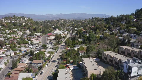 Aerial over Silver Lake hills towards San Gabriel Mountains Stock Footage
