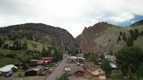 Aerial over small historic mining town of Creede Colorado on cloudy summer day Stock Footage 314130217
