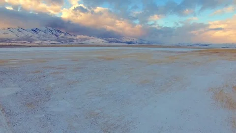 Aerial Over Snowy Fields and Farms with Mountain Reveal Vídeos de archivo 77112771